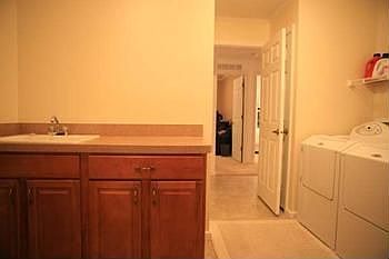 Sink and cabinets in the laundry room as well.