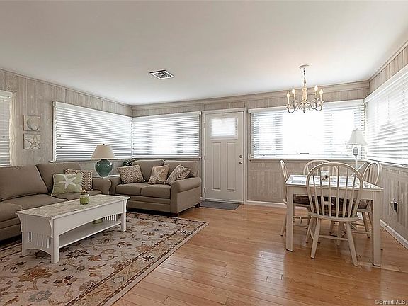 Light and bright living room with large dining area