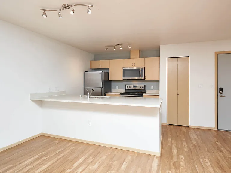 Kitchen with Breakfast Bar and Stainless Steel Appliances