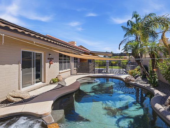 Hot tub, pool, waterfall, resort-like landscaping
