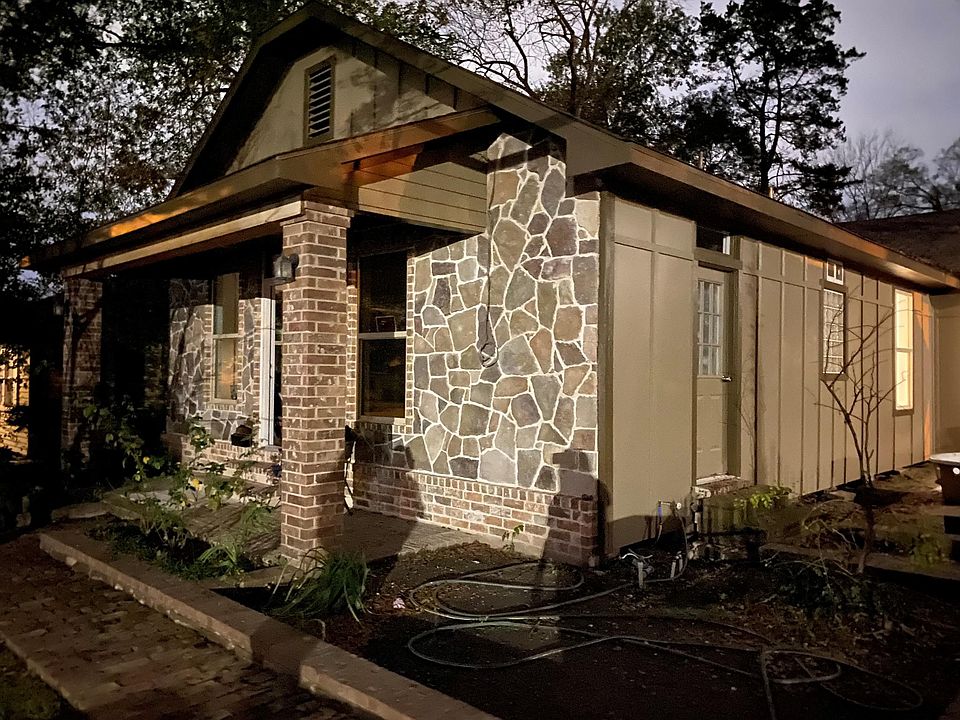 Front of the home, corner by the driveway.