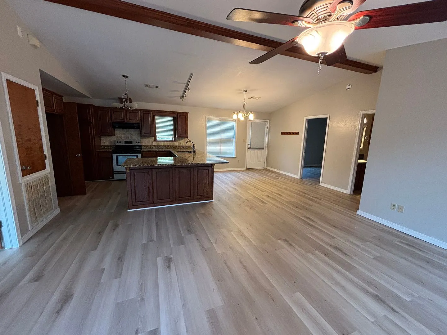 Located on the outskirts of Russellville, this three-bedroom, two-bath home — Photo 2