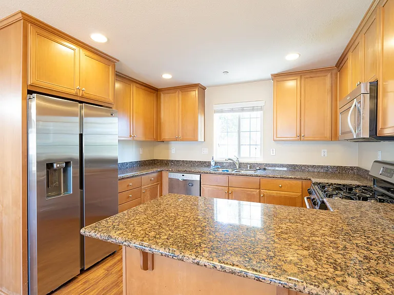Kitchen with brand newer stainless steel fridge
