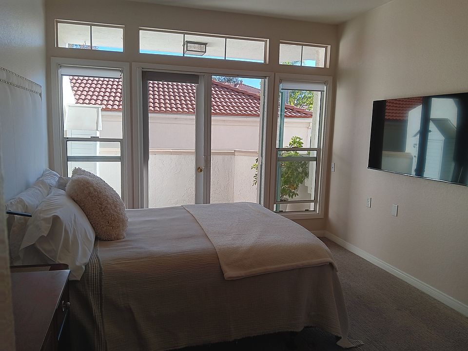 Bright and airy bedroom with queen size bed and 55" smart TV