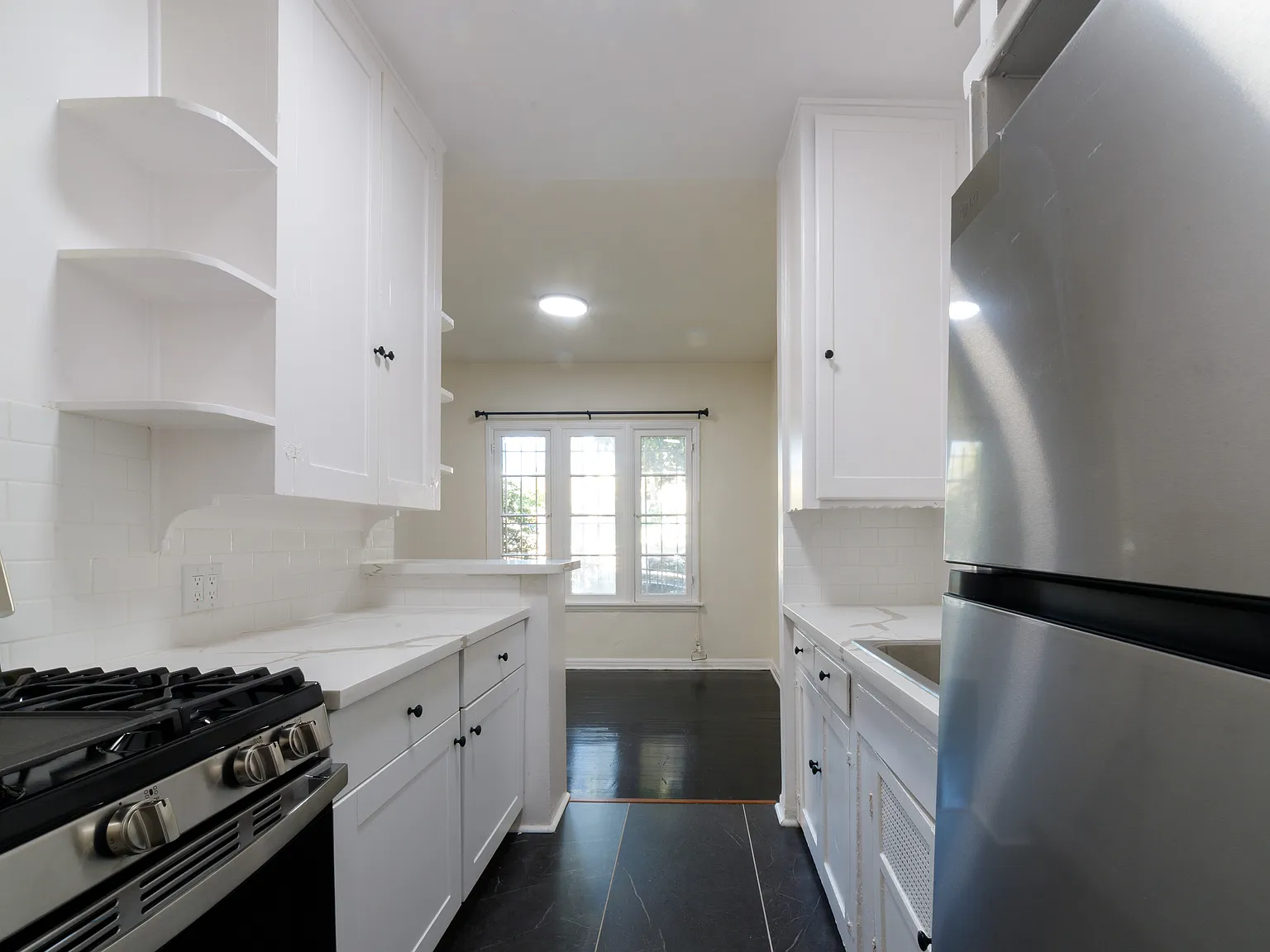 Just Updated 1,100 Sq Ft 2 Bed / 1 Bath with Deco Fireplace + Garage Parking — Photo 2