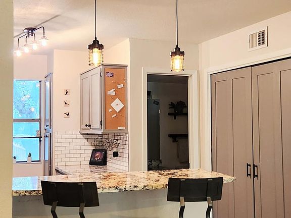 Fully stocked kitchen with bar seating