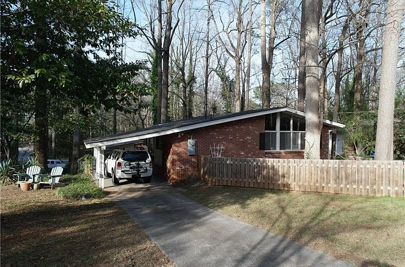 Adorable mid-century modern in hot Evergreen Forest. One of the largest lots in the neighborhood, updated, and move-in ready.  The fence on the front is a private patio area perfect for pets
