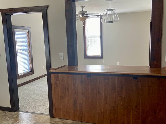 Kitchen, with bar overlooking family room