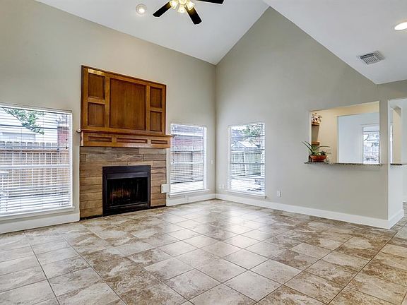 The living room is open to an updated wet bar equipped with a sink - perfect for entertaining