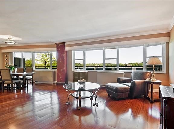 Living Room and Dining Area with exceptional views through the walls of windows.