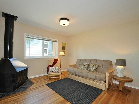 Gleaming hardwood floors in the freshly painted living room.
