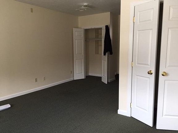 Living room has a nice sized window and two closets and can accommodate a couch/desk/etc