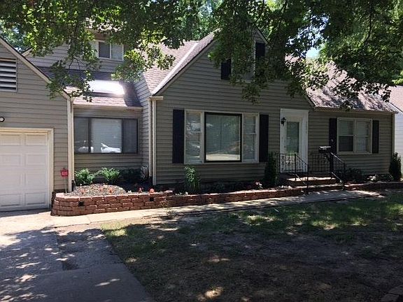 Front of House with New Flower Beds