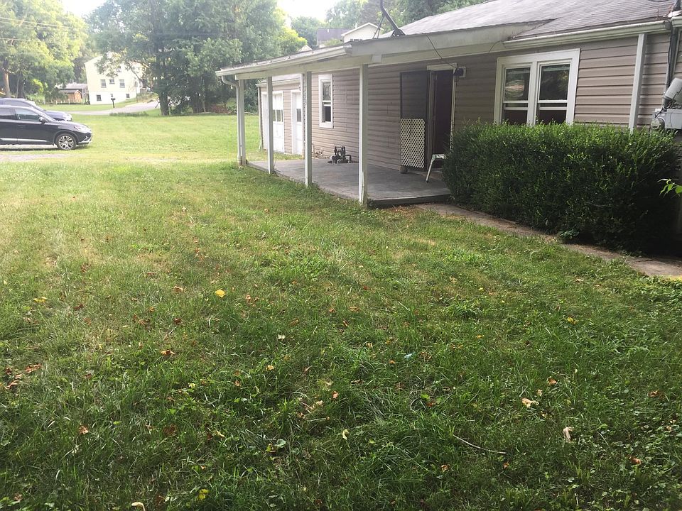Front porch. Large yard with ample off street parking.