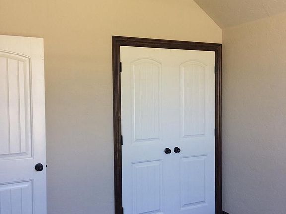 office or 4th bedoom off entry has vaulted ceiling