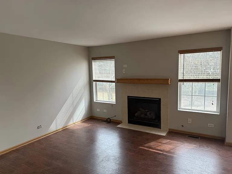 Family room w/ fireplace, open plan allowing natural lighting