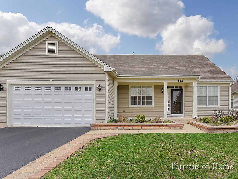 Covered Front Porch, Upgraded hardscape and brick driveway extenwion.