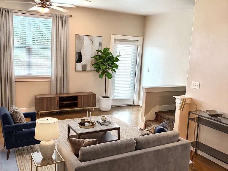 Welcome to this townhome ground floor social open floor plan: Kitchen, living and dining with a beautiful patio