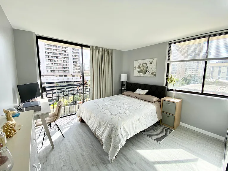 The Master bedroom features a Queen size bed, medium firm mattress, and large windows. View to a park