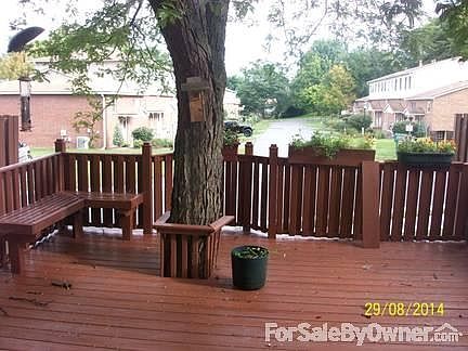 built-in bench/flower containers
						:
						tree for baby swing/newly stained, large deck/designed fence, stone path outside