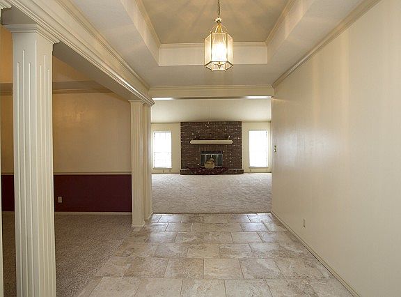 Entry with direct view of fireplace