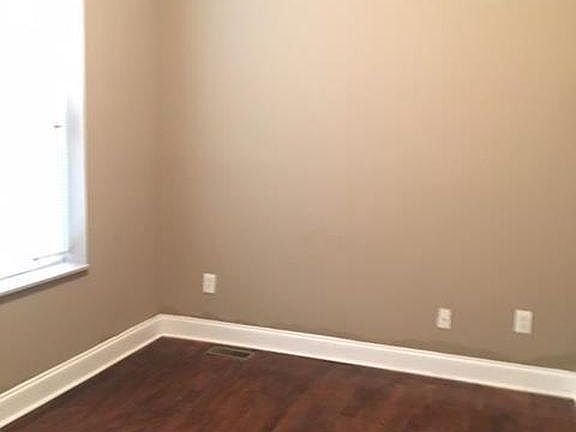 Bedroom 1 with closet and hardwood floors