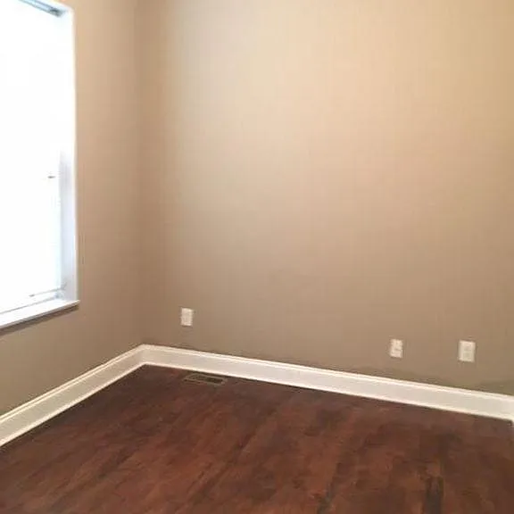 Bedroom 1 with closet and hardwood floors
