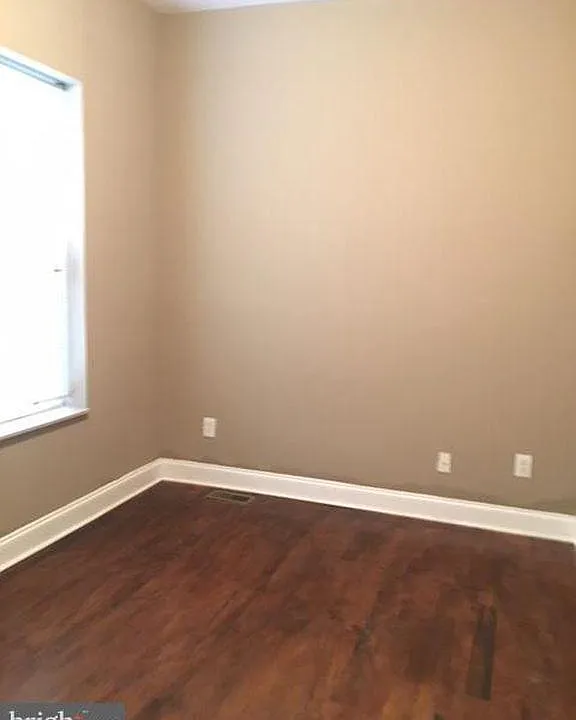Bedroom 1 with closet and hardwood floors