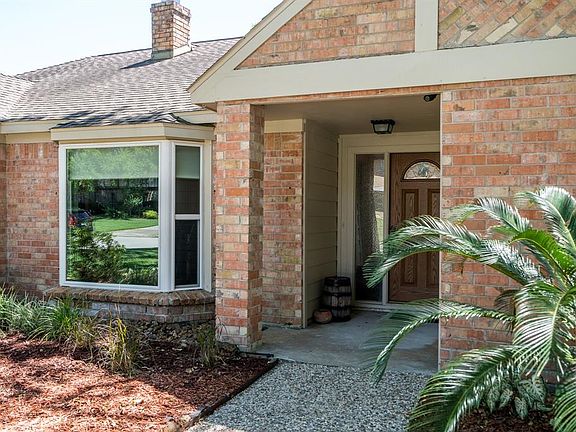 Such a charming walk up to your covered front porch with large bay window views.