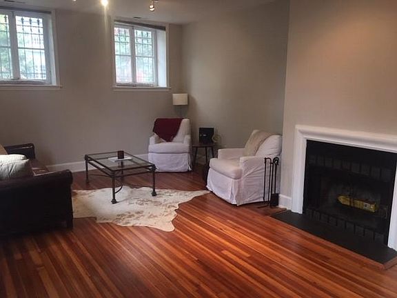 Furnished living room with fireplace.