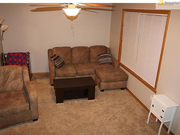 Living Room with new ceiling fan and blinds