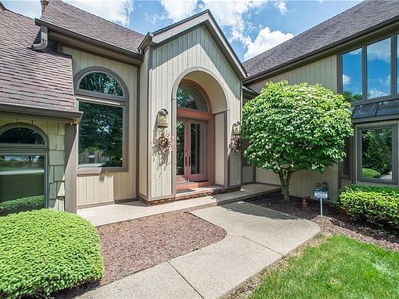No cookie-cutter architecture here. This property provides a grand entrance thanks to double doors and varied roof lines.