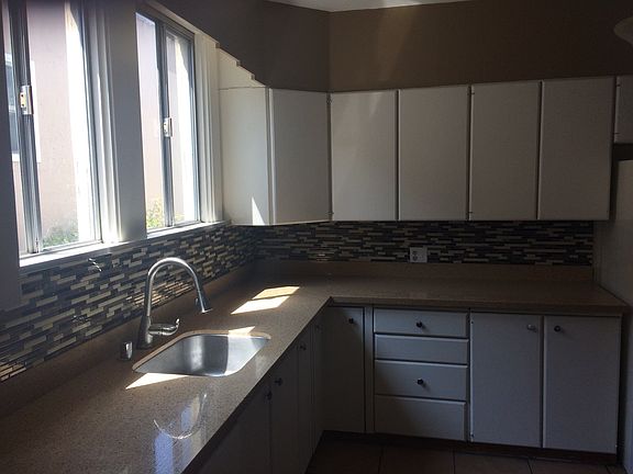 Updated kitchen. with tile flooring. Many windows.