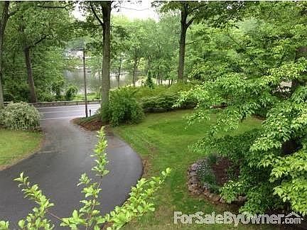 Walkway curves up to entry door