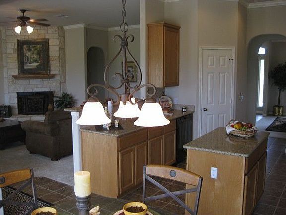 Island kitchen with tile floors, and tile backspalsh