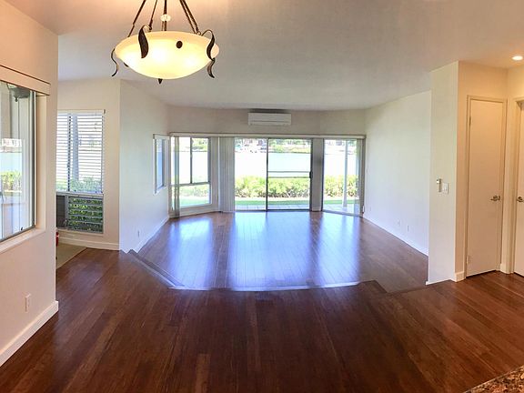 Large Sunken Living Room with new Air Conditioning and Hardwood Floors.