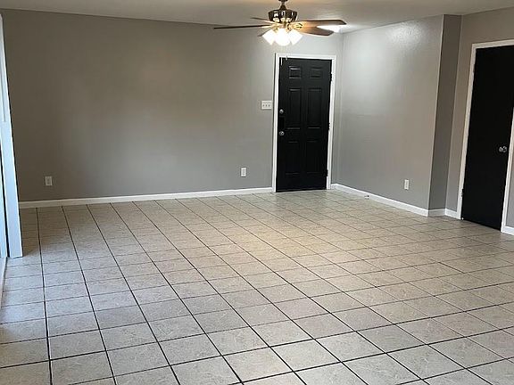 Ceiling fan in living room provides lots of light and saves on utility bills.