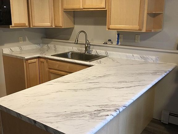 Breakfast bar area in kitchen, next to dining room, for additional seating