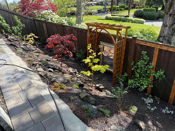 Fully landscaped Japanese-garden style backyard - peaceful and low maintenance with gorgeous evergreen plants