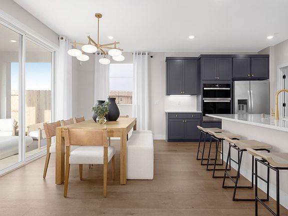 Kitchen and dining area with access to the backyard