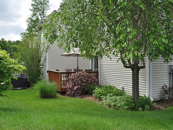 Private oversized deck with stone platform for grill
