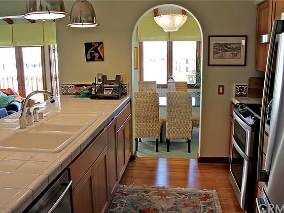 Stainless dishwasher, bottom freezer refrigerator, and gourmet double oven.