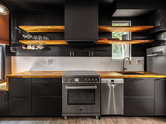 beautiful kitchen that is full sized and fully functioning.