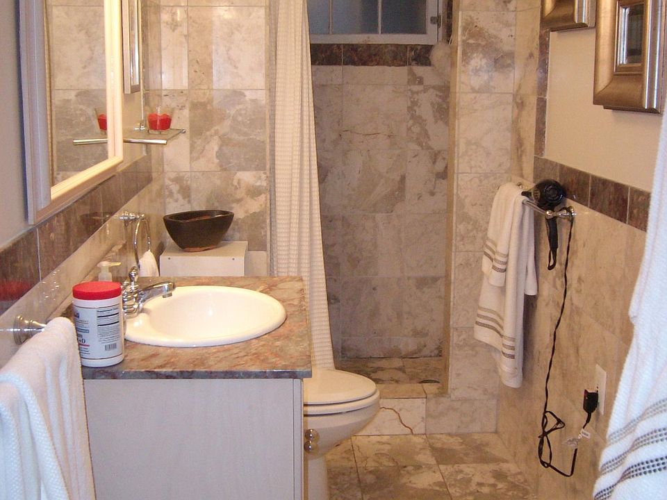 Marble bathroom off the bedroom.