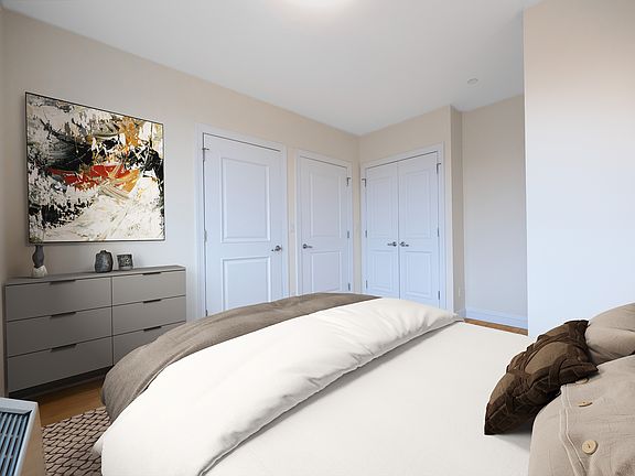 a bedroom with a bed in a room