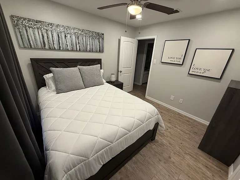 Bedroom 2 - a queen bed and smart tv.