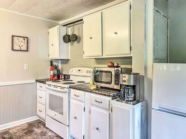 Since the time this picture was taken, the countertop was replaced and a larger fridge was added.