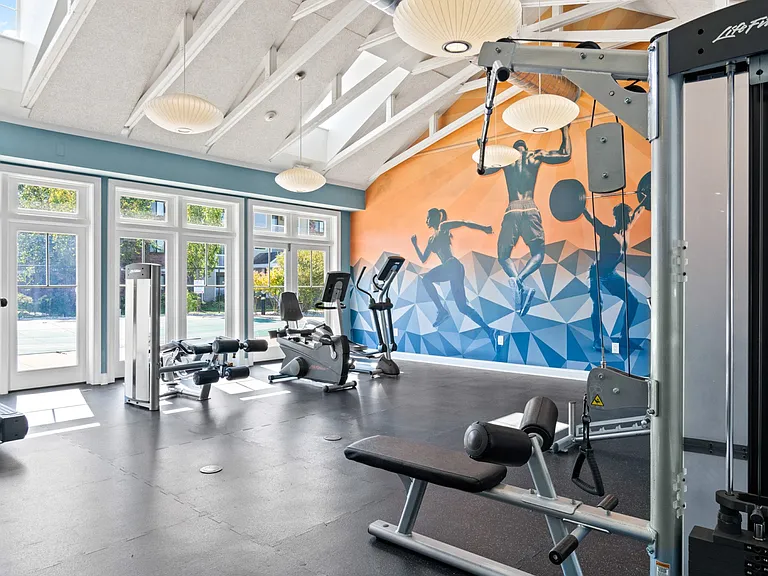 Fitness center flooded with natural light t at Rosemont Square in Randolph, MA