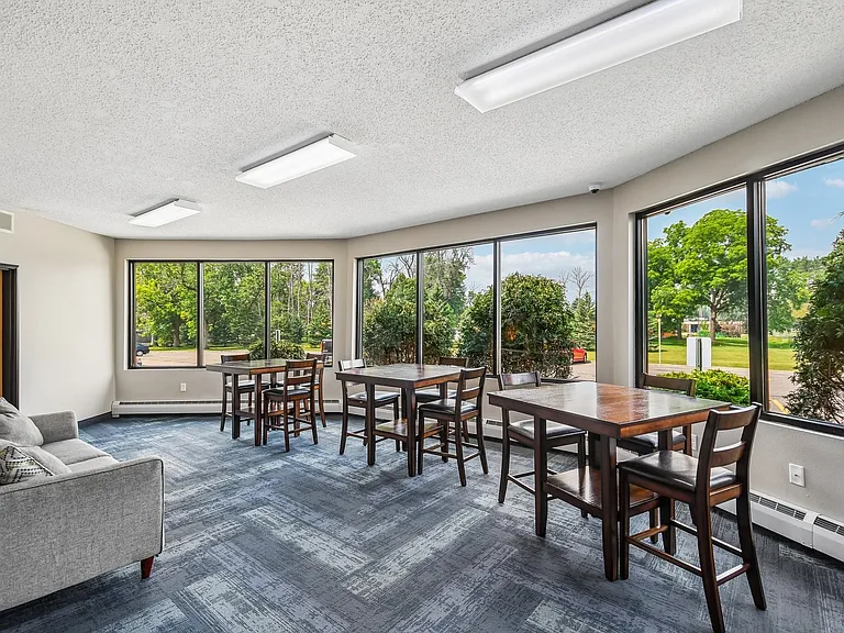 Elevate your lifestyle at Mill Pond Apartments with our bright and inviting common area. Large windows flood the space with natural light, perfect for gatherings or relaxation. Come see how comfortable living can beschedule a visit today!