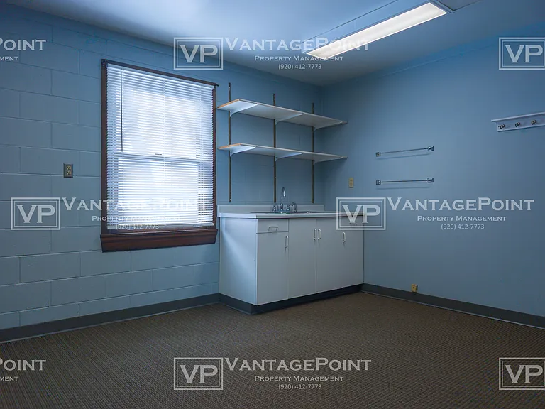 Back Storage and office area with sink.